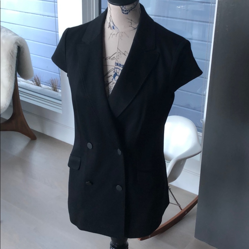 Black cap sleeved double breasted knit blazer top